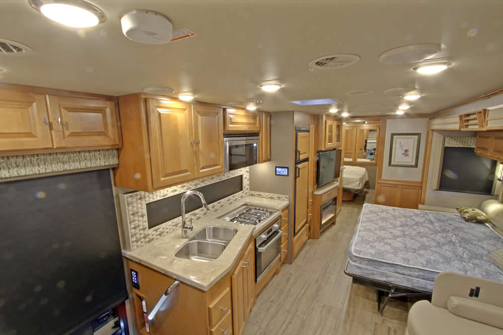 above view of living room, kitchen and queen size bed
